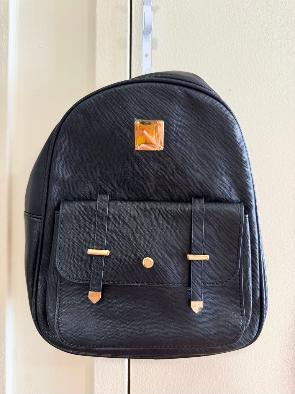 Compact Black Mini Backpack with Gold Accents